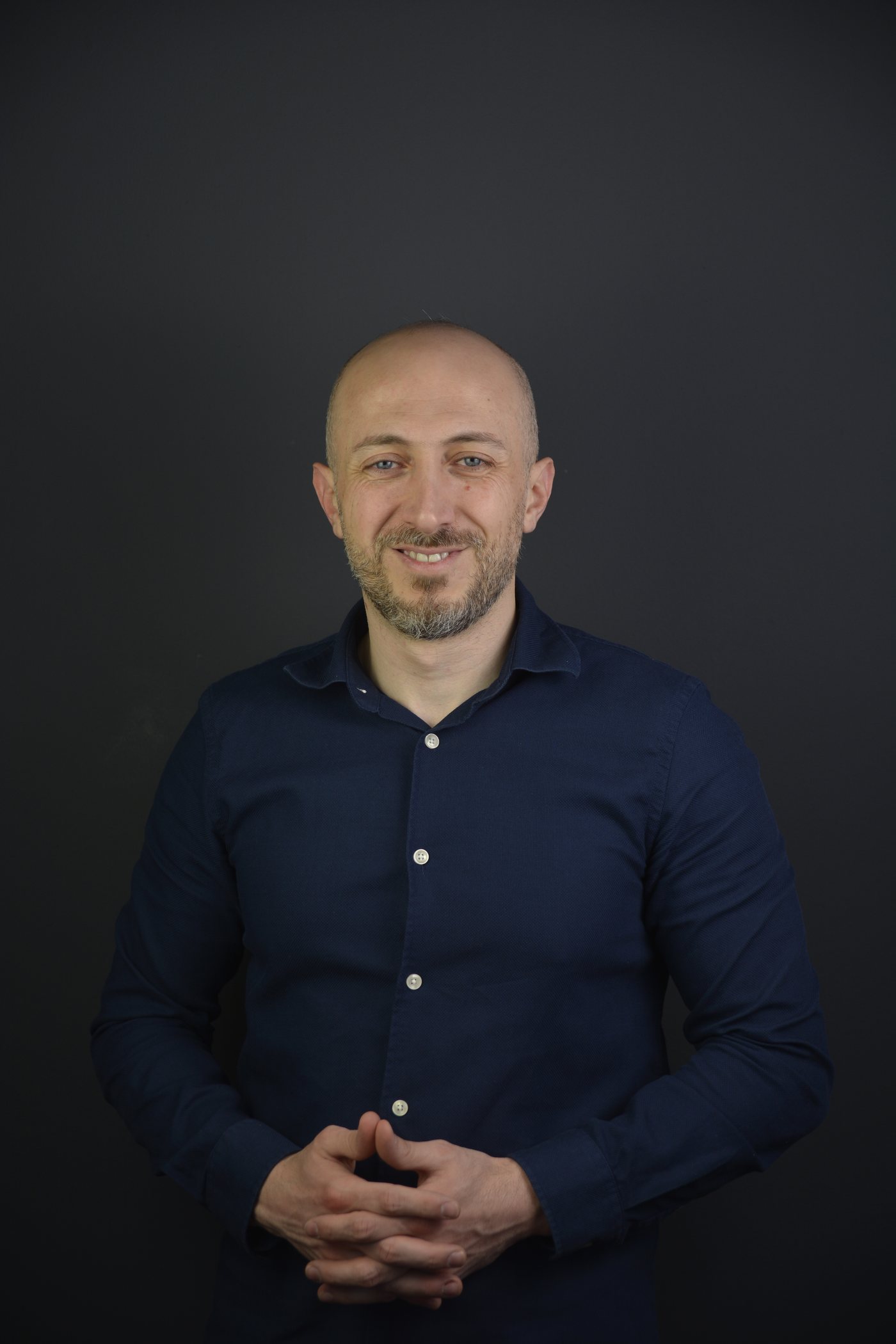Anees Alomar, studio portrait.