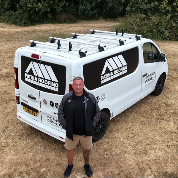 Nick Collier, owner of Patina Roofing, with his van