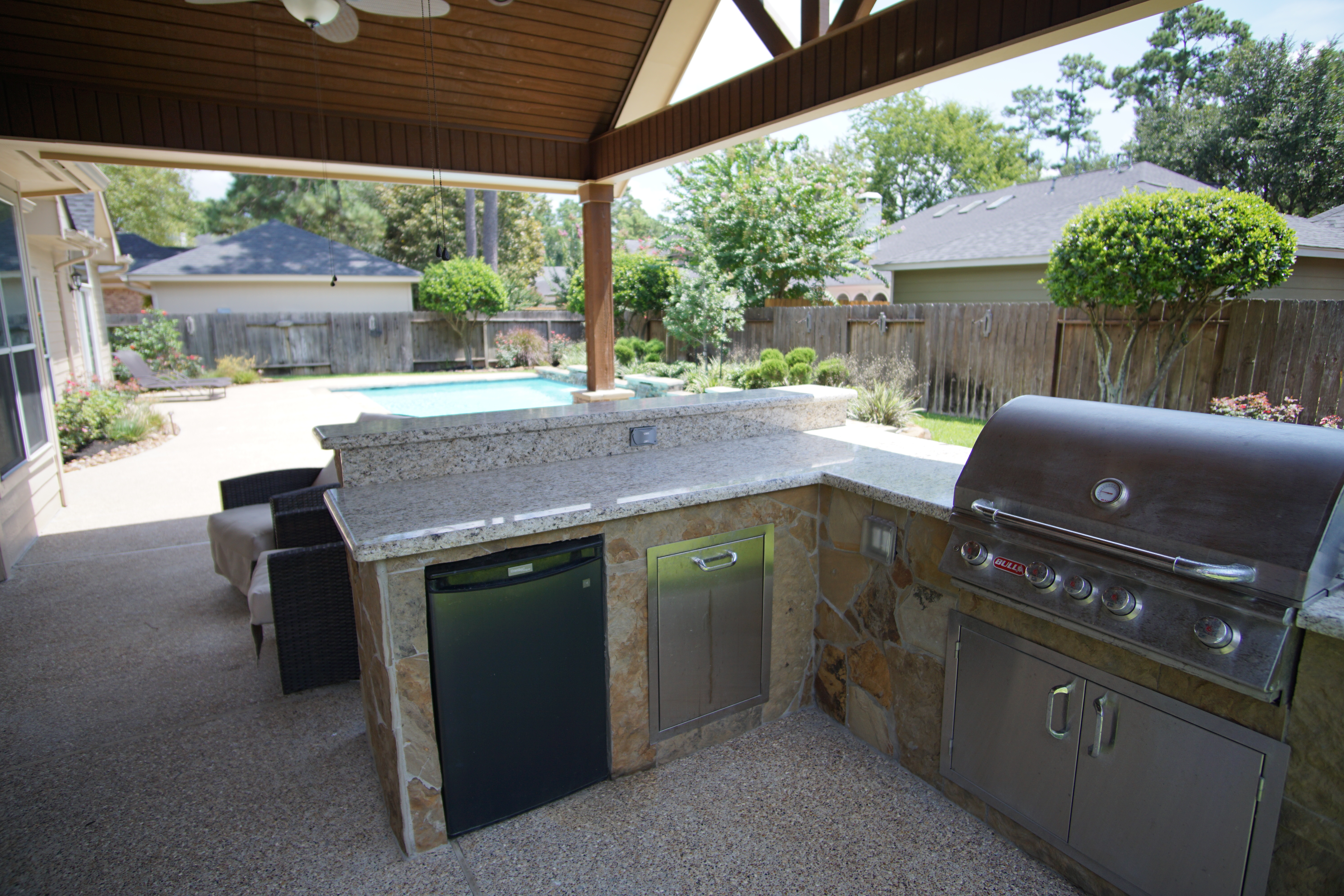 Outdoor living space with custom pool and patio in Houston area