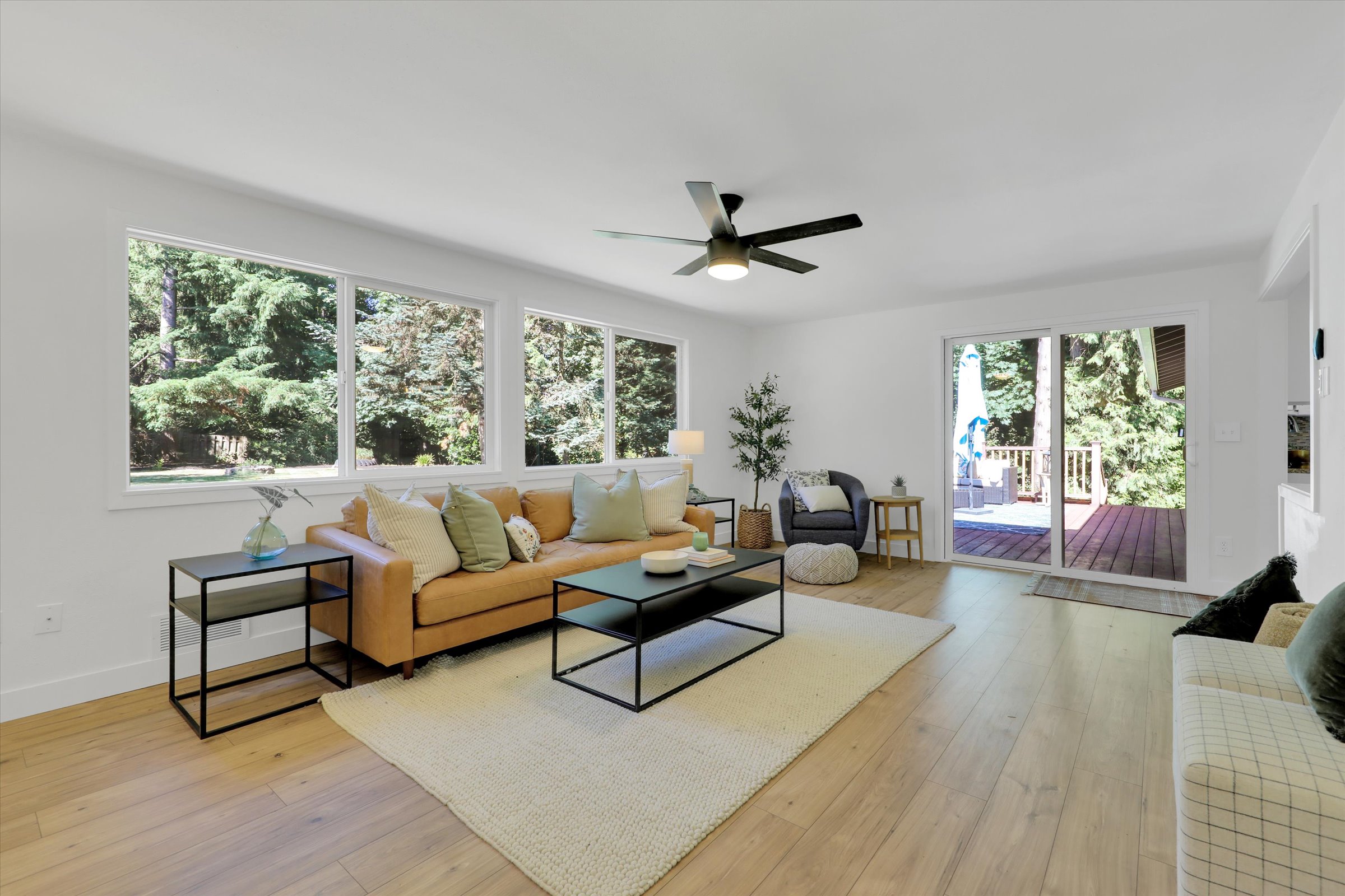 Luminous Open Interiors — Crisp modern lighting and brand-new flooring elevate the open-concept living space.