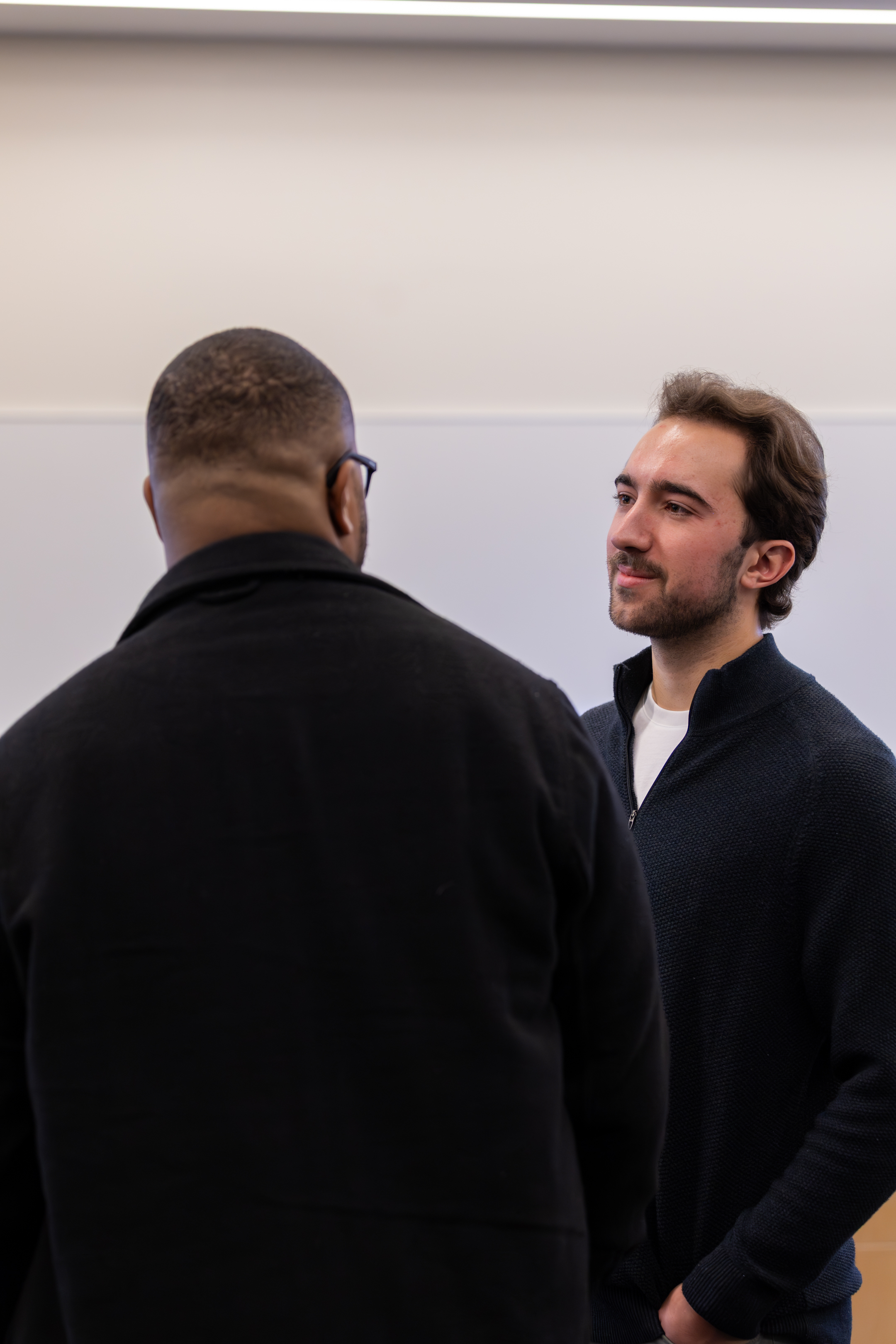 Attendees in conversation at a past MDS conference
