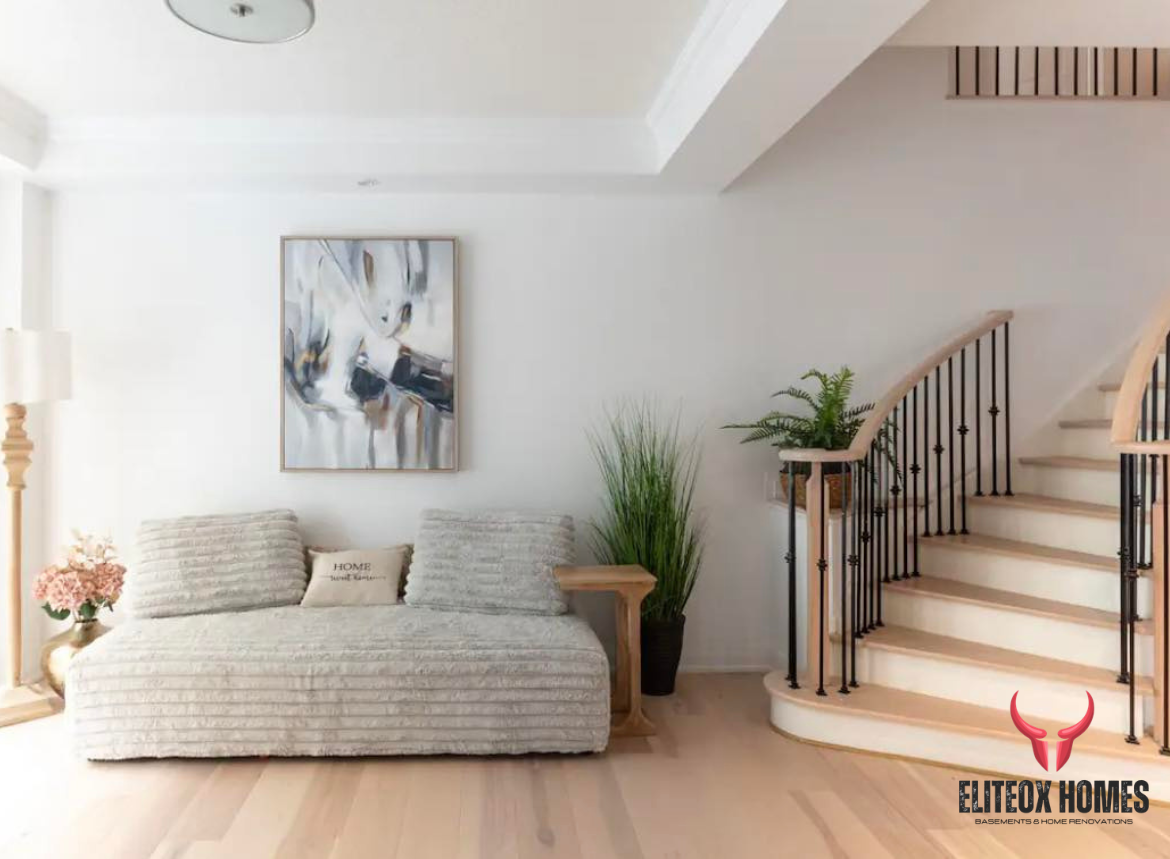 Finished basement family room by EliteOX Homes
