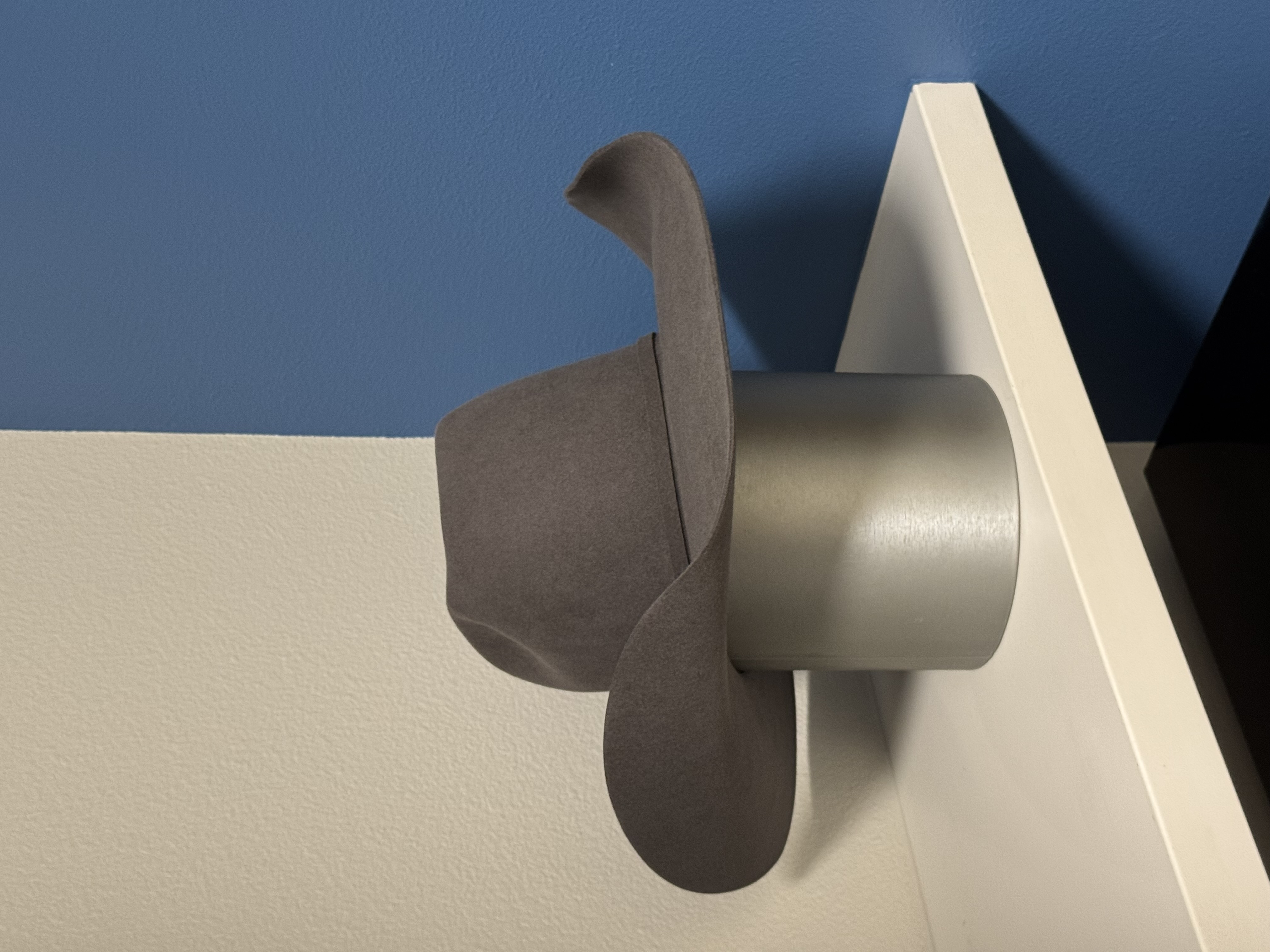 Gray felt cowboy hat on display