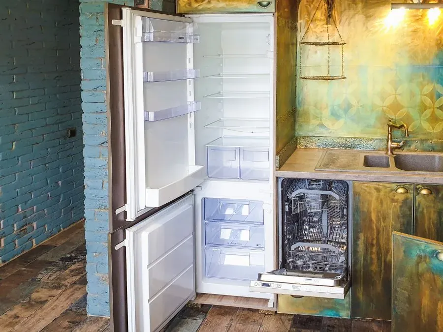 Representative stock photo of an open dishwasher in a kitchen