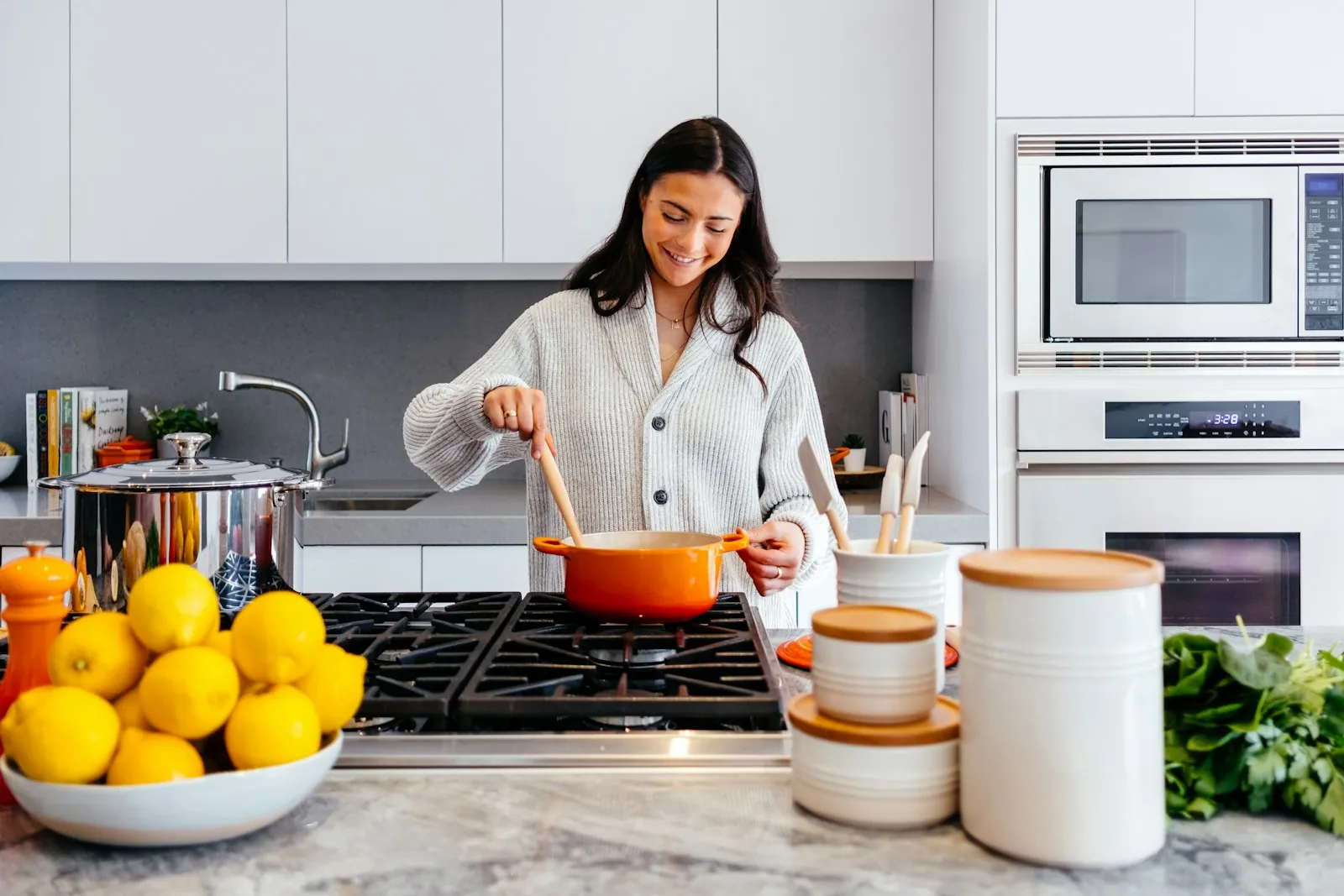 Representative stock photo of someone cooking in a bright kitchen