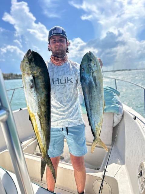 Angler holding caught fish