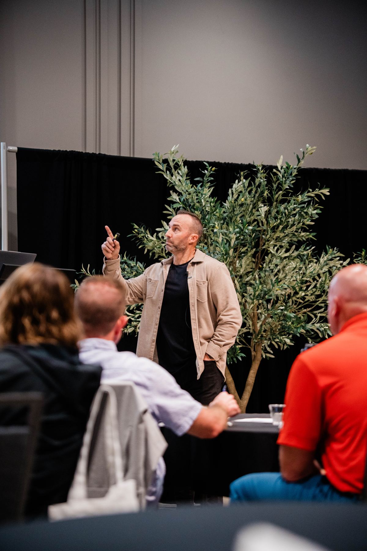 Coach Brian Fryer coaching a room of network marketers