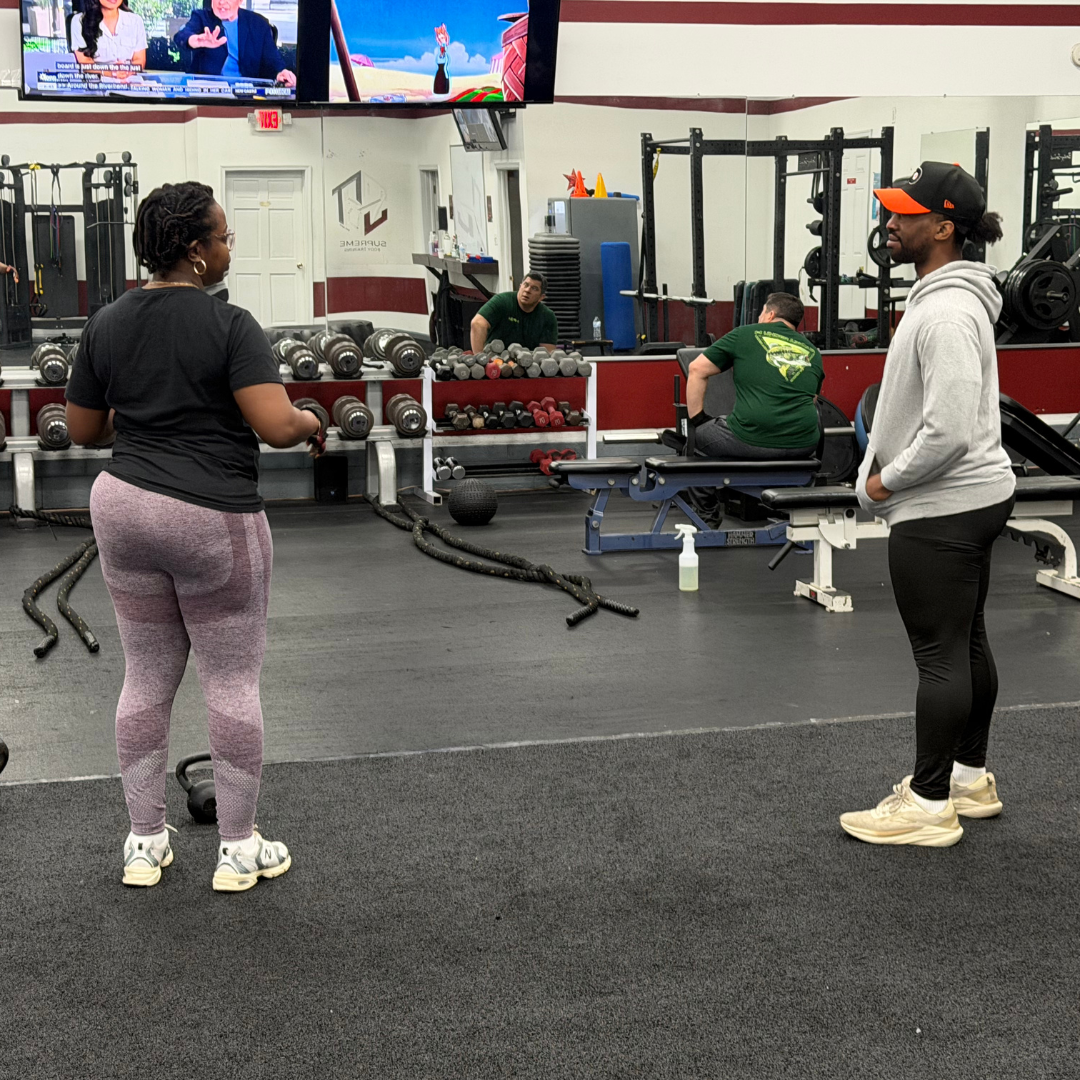 Member receiving personal training coaching at Supreme Body Training