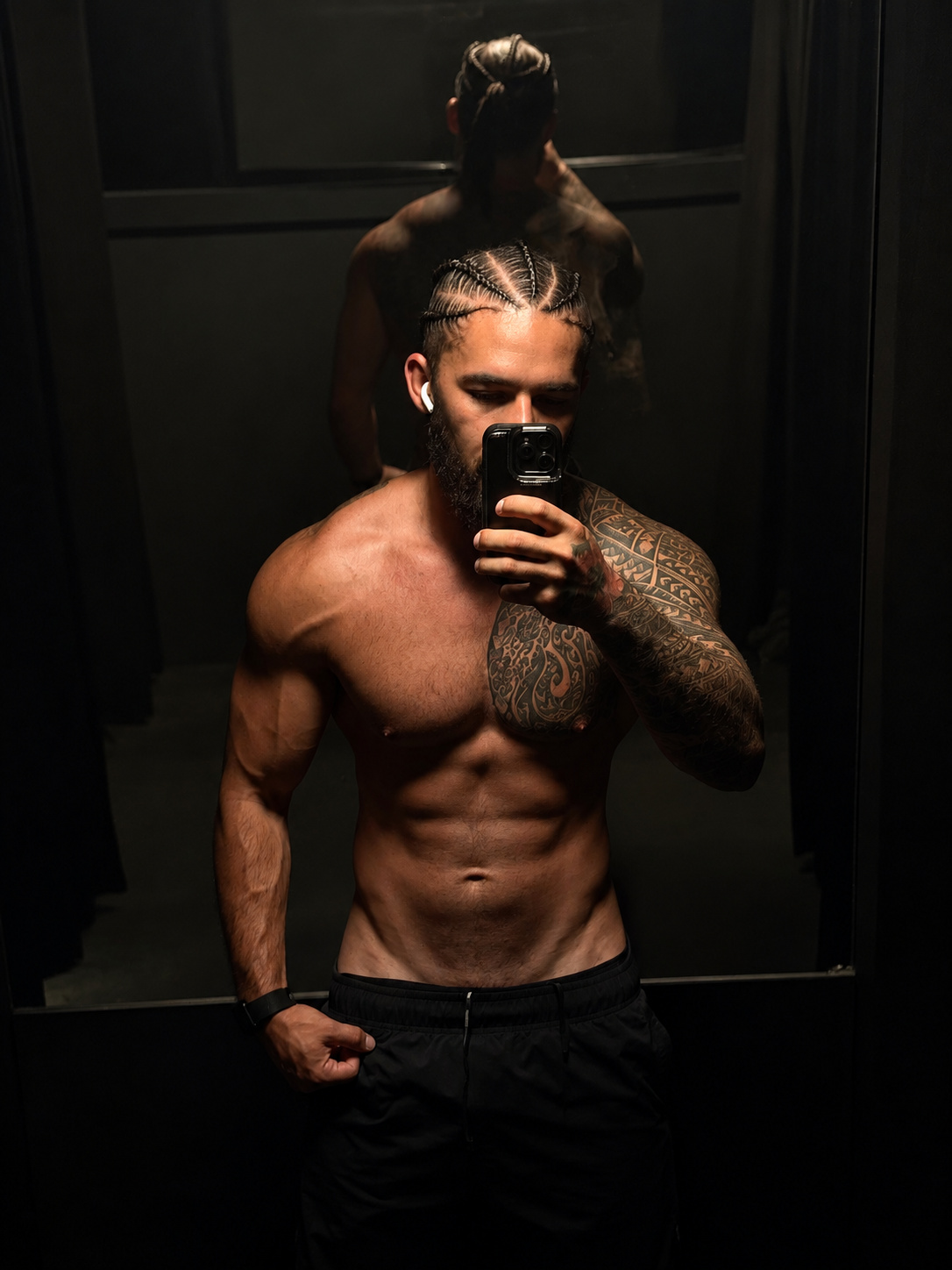 Justin taking a fitness mirror photo