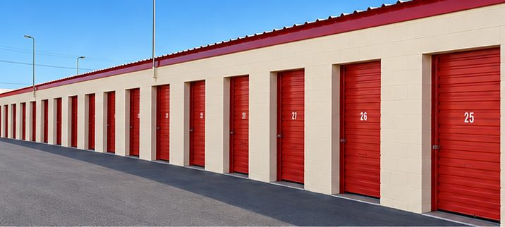 A row of red drive-up storage unit doors at CapRock Self Storage in Lubbock