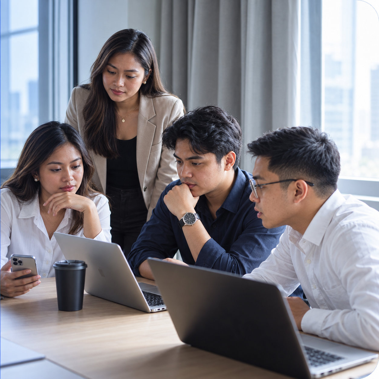 Filipino and Asian professionals collaborating together in a workshop-style meeting
