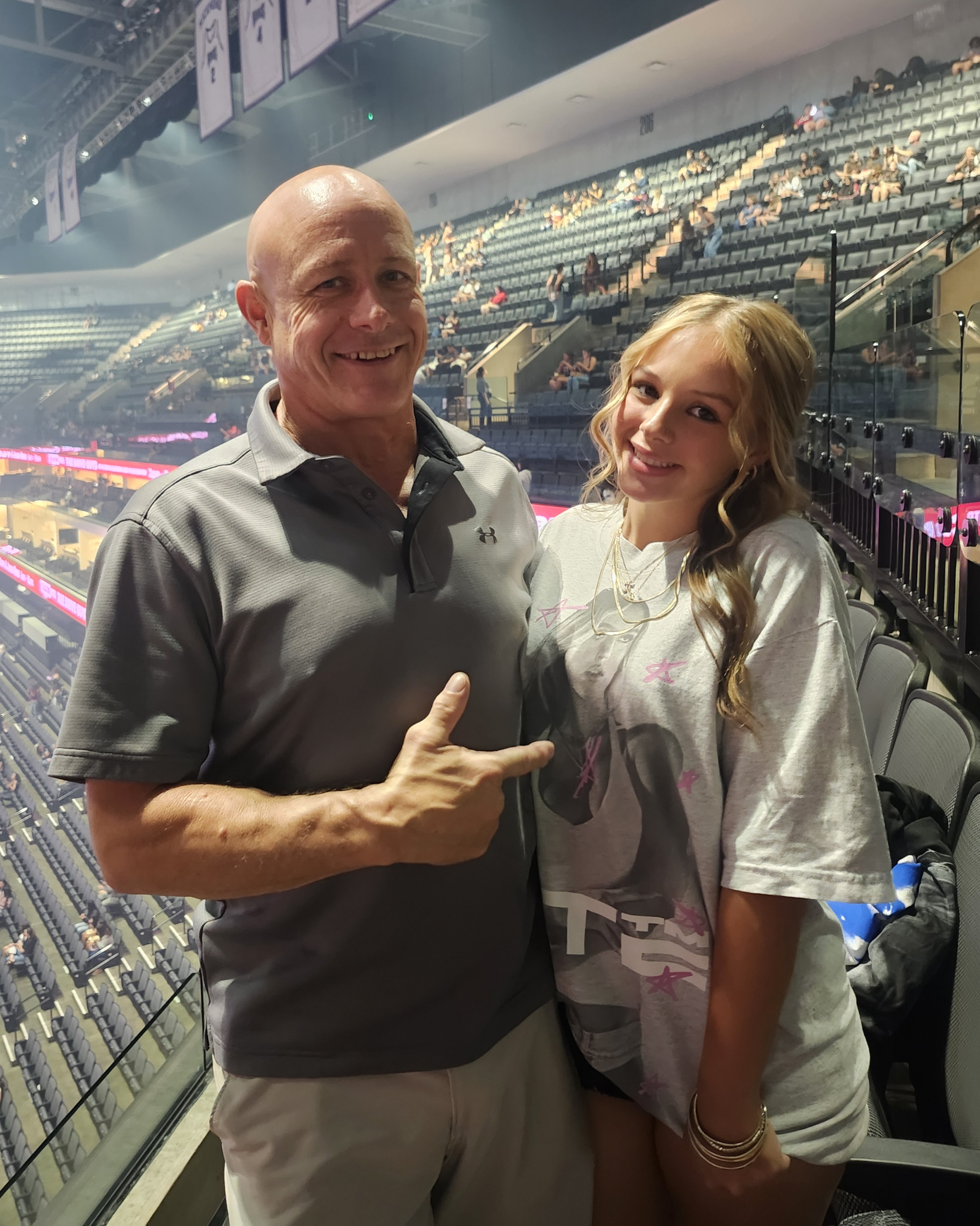 George and teenage Taylor at a concert together — a father and daughter sharing the things they loved