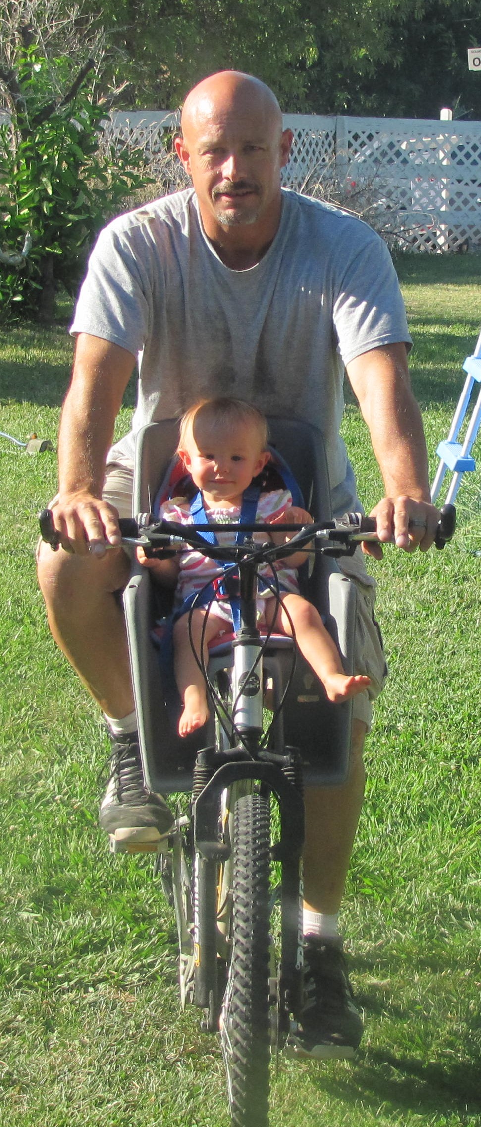 Baby Taylor in the front seat of George's bike — their very first adventure together
