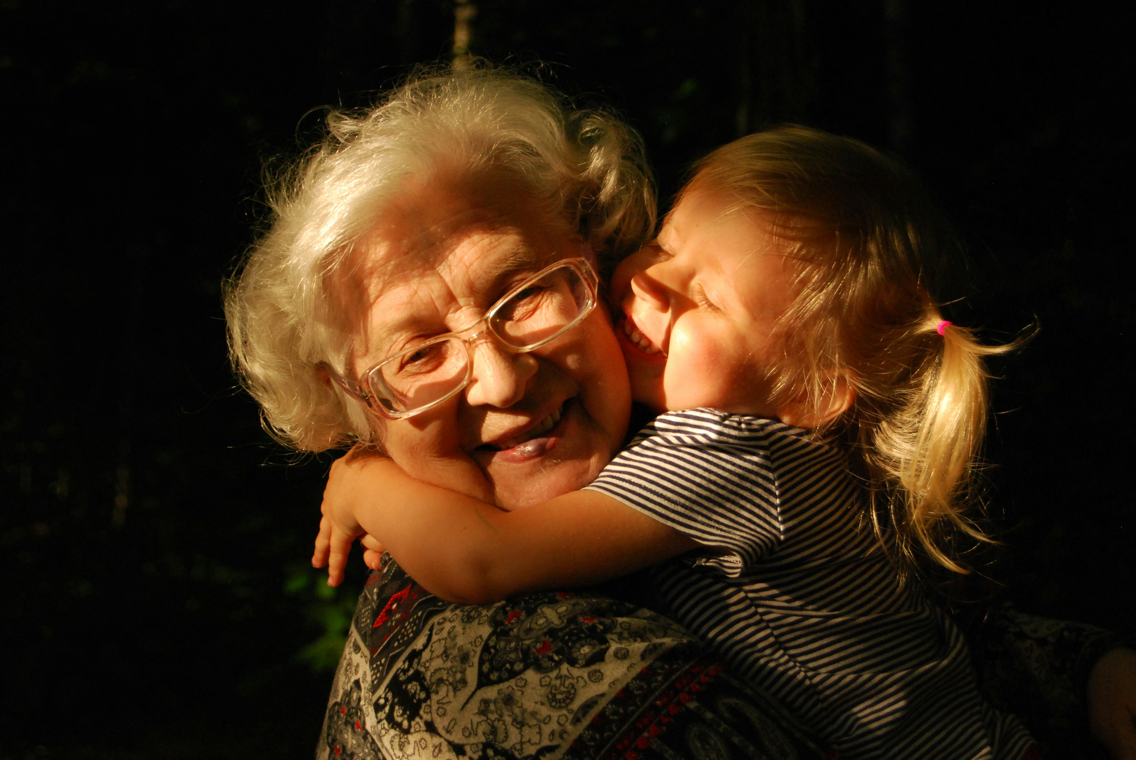 Little child hugging grandma