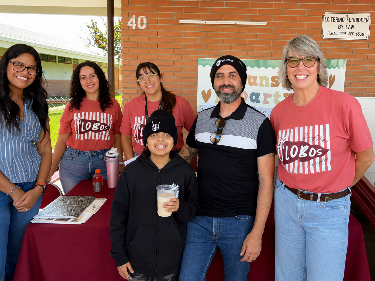 Anthony Armendarez with school staff at a school event