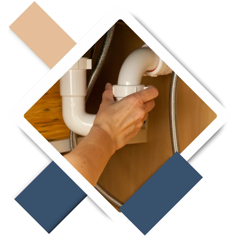 Skilled handyman repairing a leaky faucet for home maintenance.