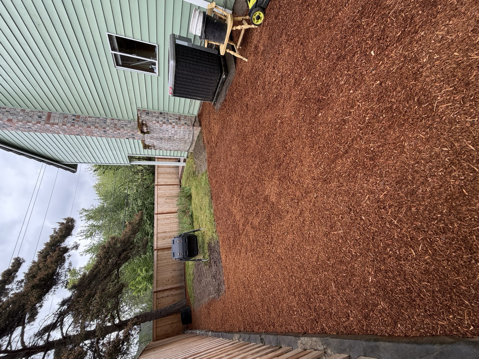 Fresh bark mulch covering a backyard