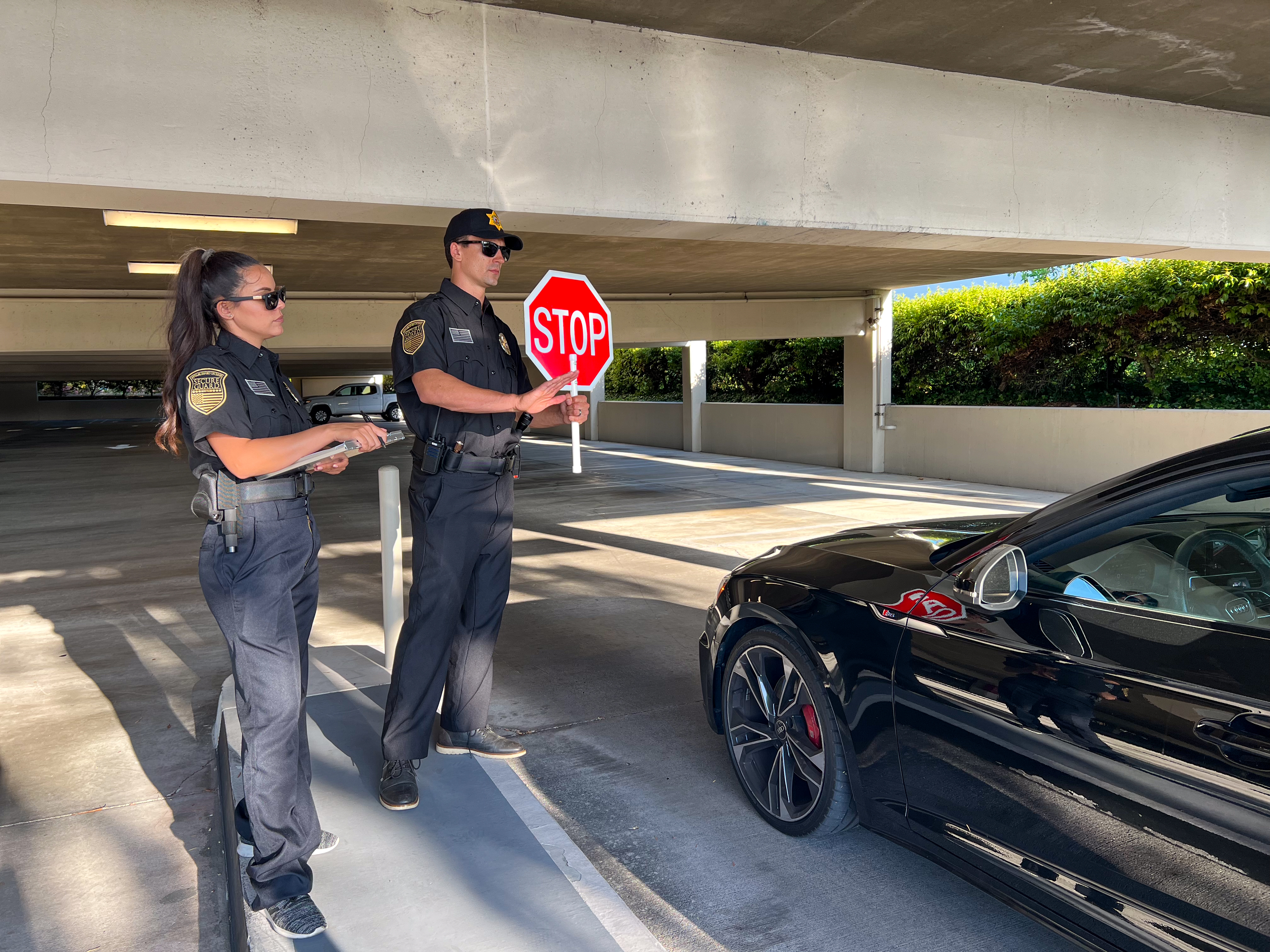 Traffic Control and Construction Site Security Flaggers directing vehicle flow