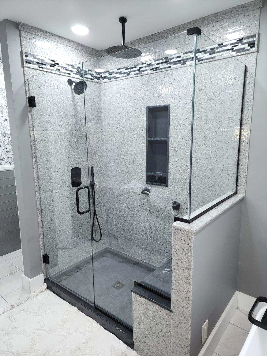 Beautiful Onyx shower bathroom remodel in London KY with frameless glass shower doors.