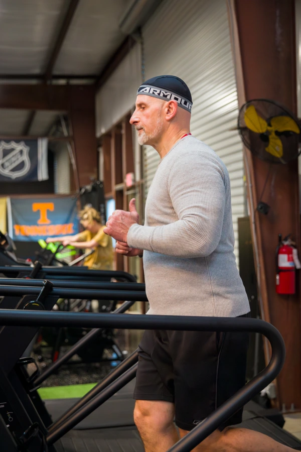 A man runs on a treadmill at Yellow Brick Fitness in White House, TN