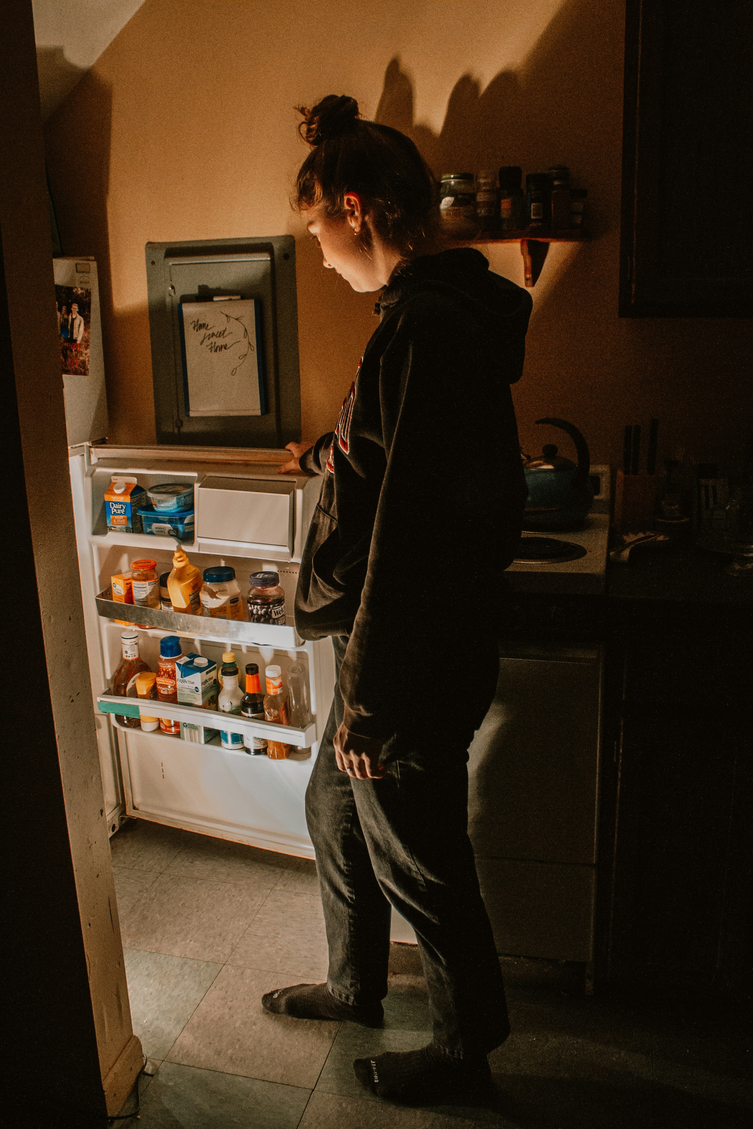 Woman looking in fridge