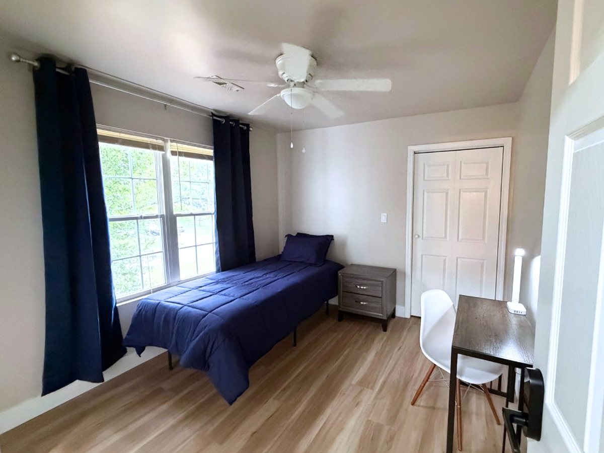 Private bedroom with desk