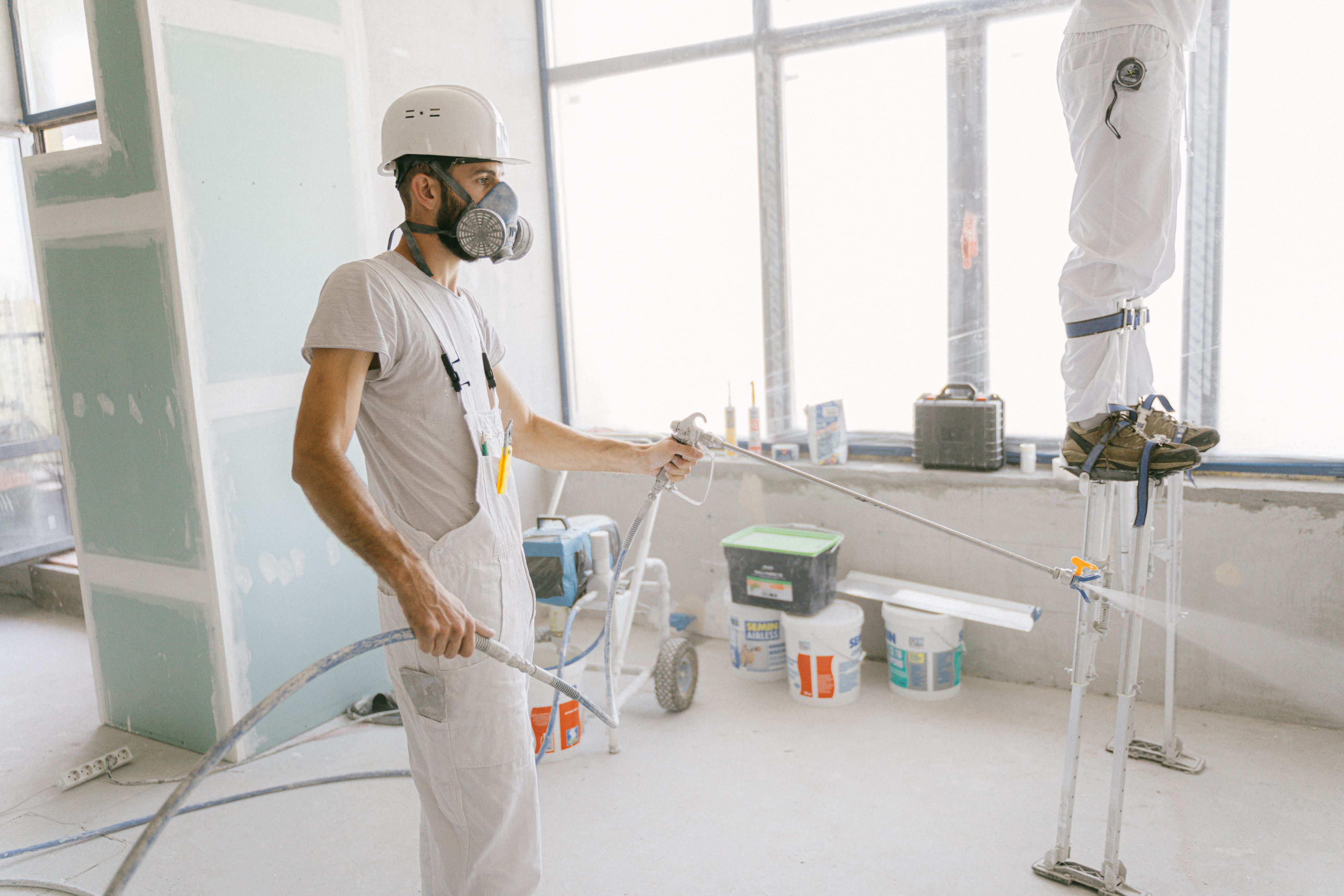 Residential wall being repaired and prepared before painting
