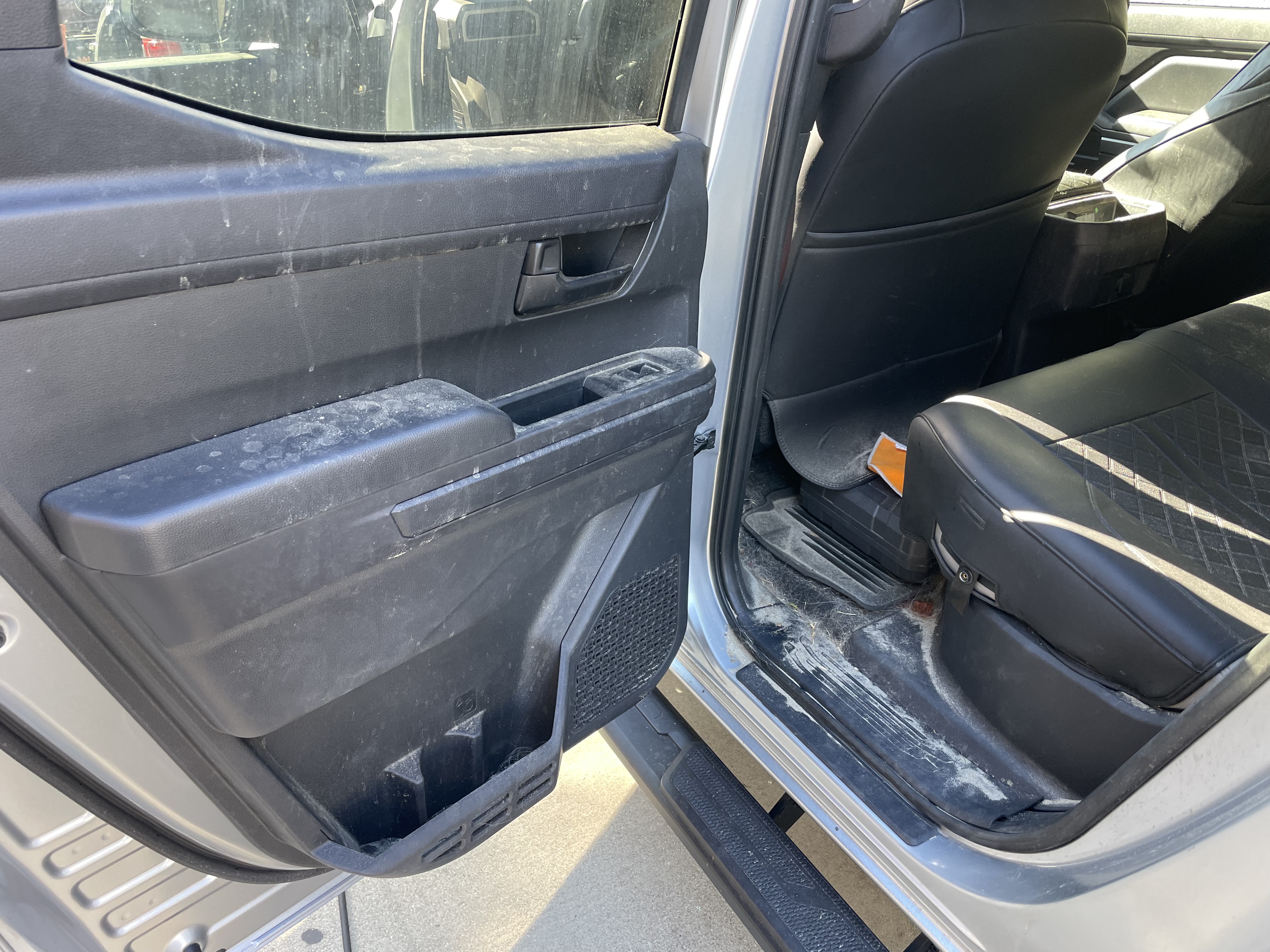 Vehicle door panel and interior showing areas where odor-causing contamination can collect