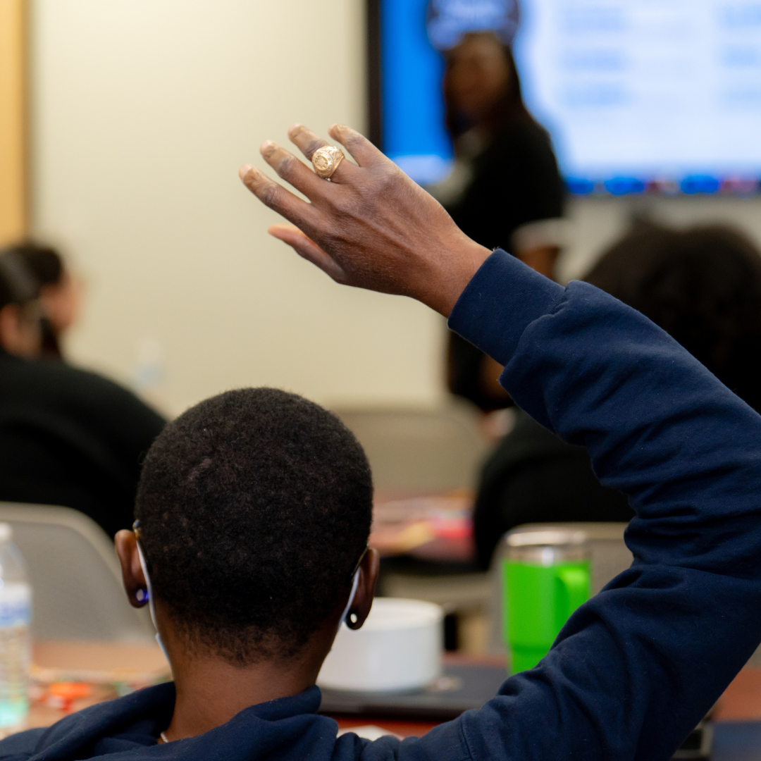 CHW Student raising hand