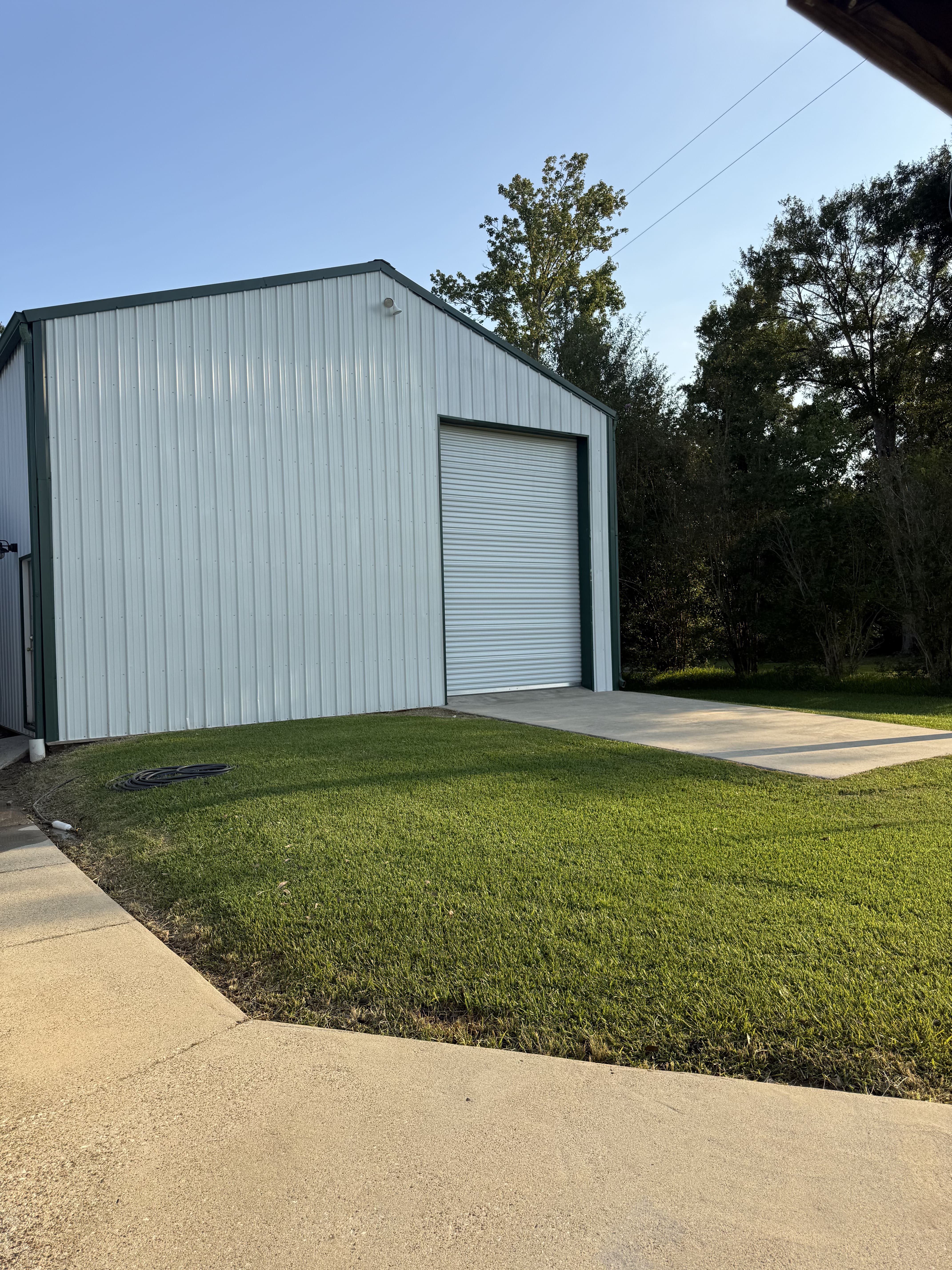 driveway pressure washing before and after in Sulphur, LA by Elite Exterior Cleaning