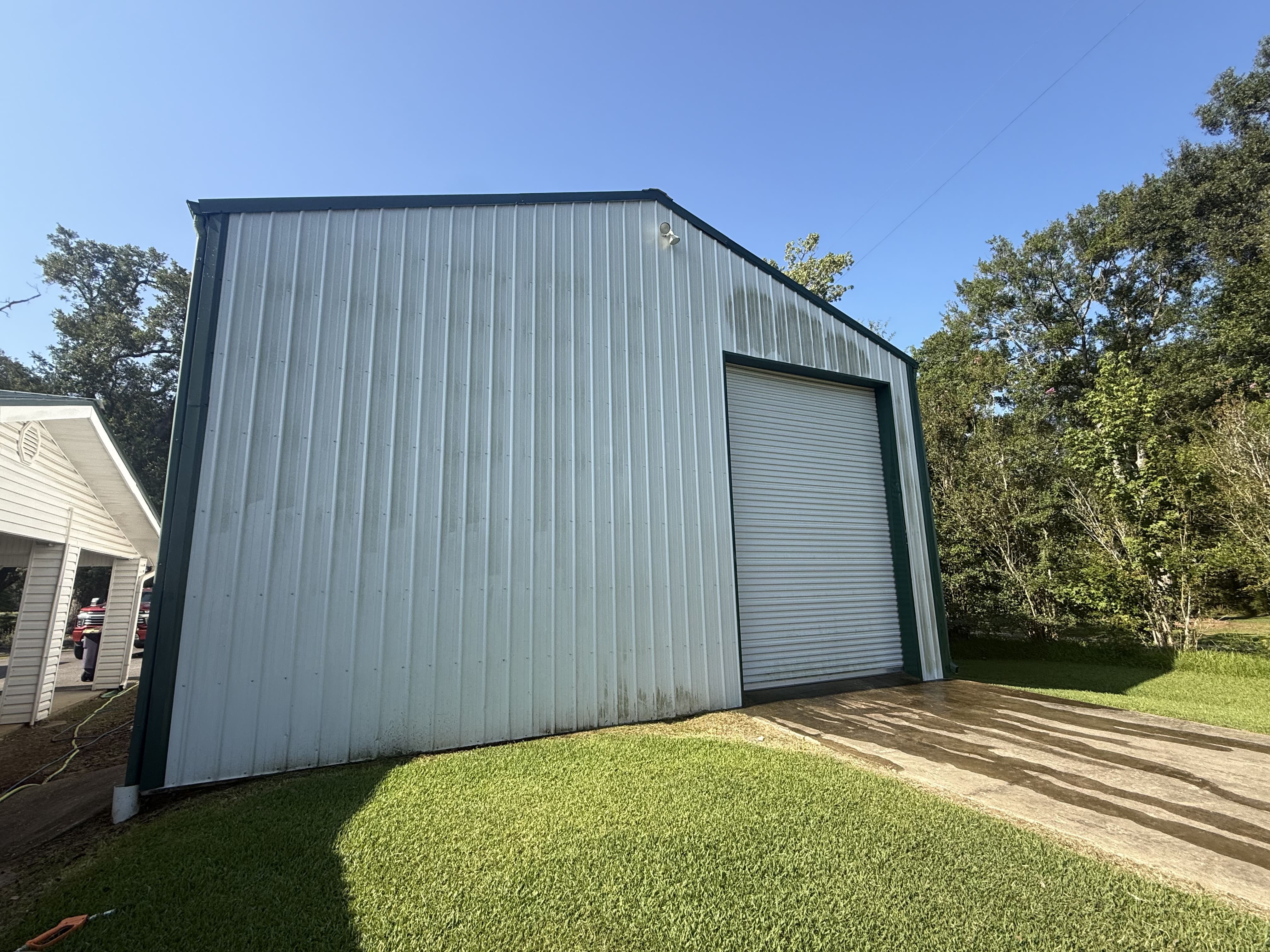 driveway pressure washing before and after in Sulphur, LA by Elite Exterior Cleaning - before