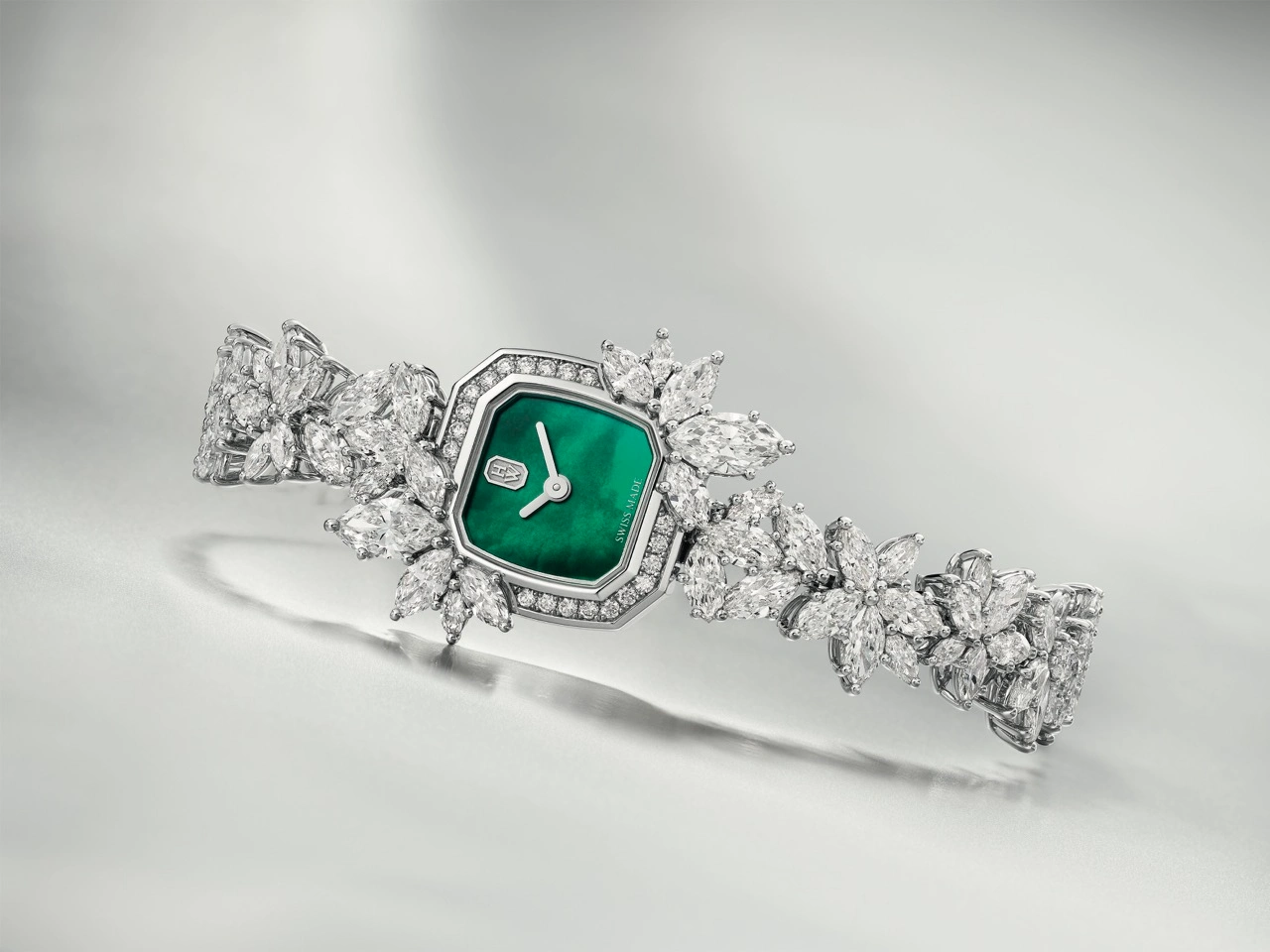 Harry Winston Precious Emerald high jewelry timepieces with Winston Cluster bracelet