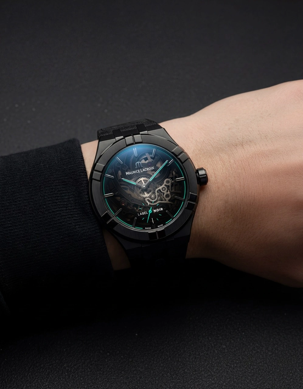 Maurice Lacroix AIKON Automatic Label Noir with black DLC case and turquoise accents on nubuck strap