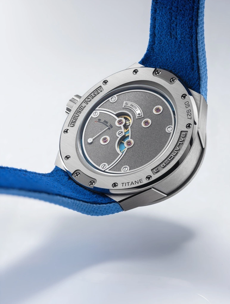Close-up of the Greubel Forsey Balancier 3 GF09cx frosted titanium central bridge and blue accents