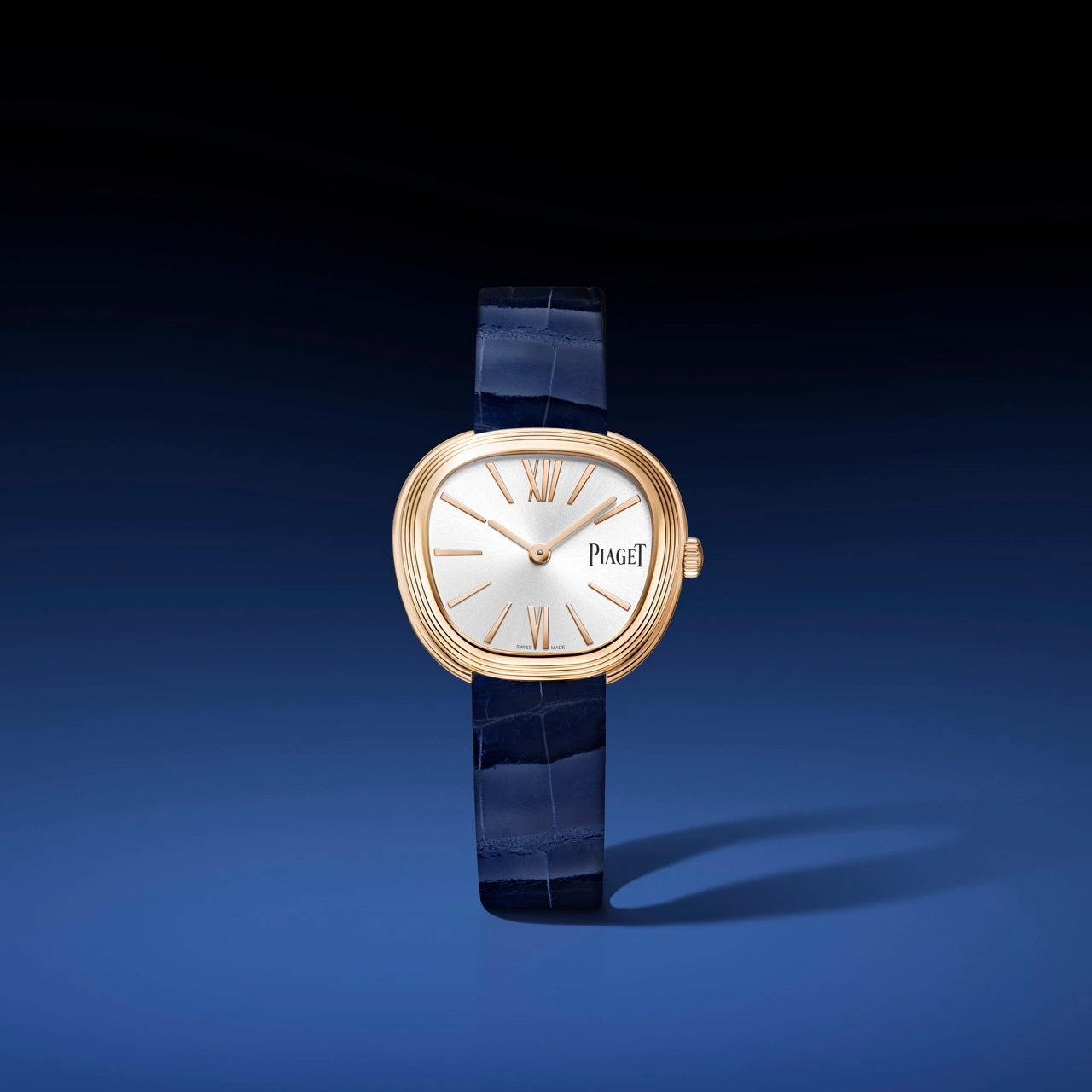 Close-up of Piaget cuff and pendant watches with ornamental stone cases