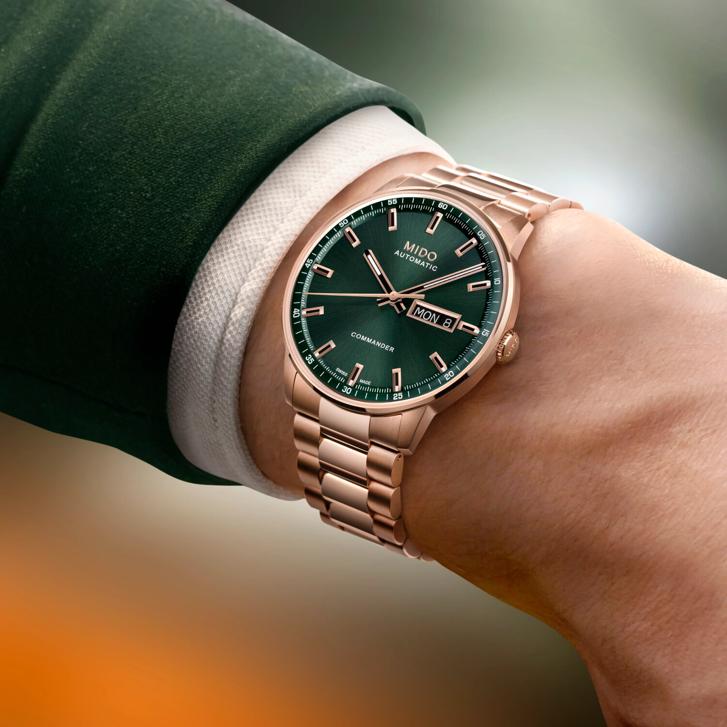 MIDO Commander Datoday with rose-gold PVD bracelet and sunray-brushed green dial