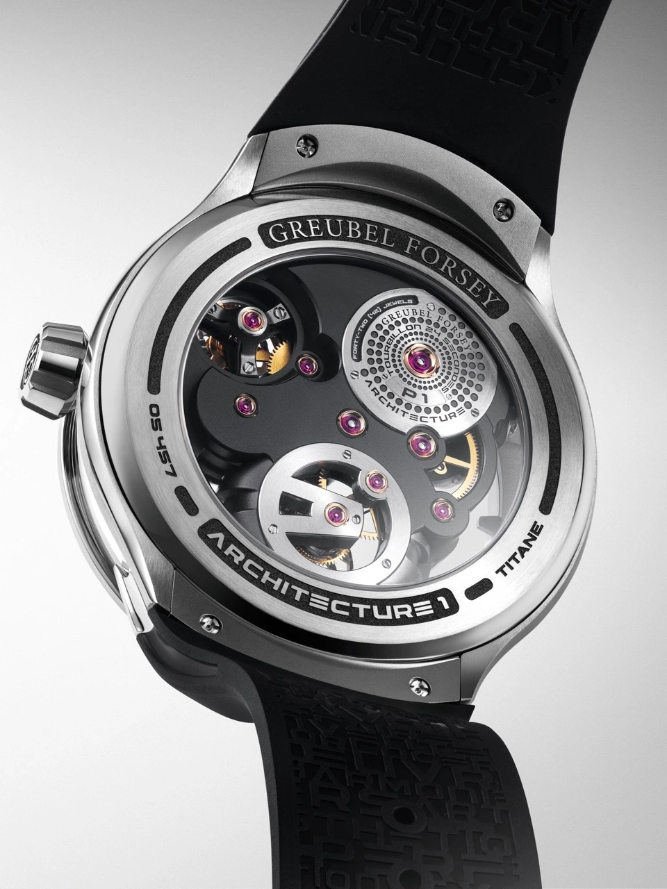 Rear three-quarter view of the Greubel Forsey Tourbillon 24 Secondes Architecture GF01H showing the caseback inscription and titanium bridges