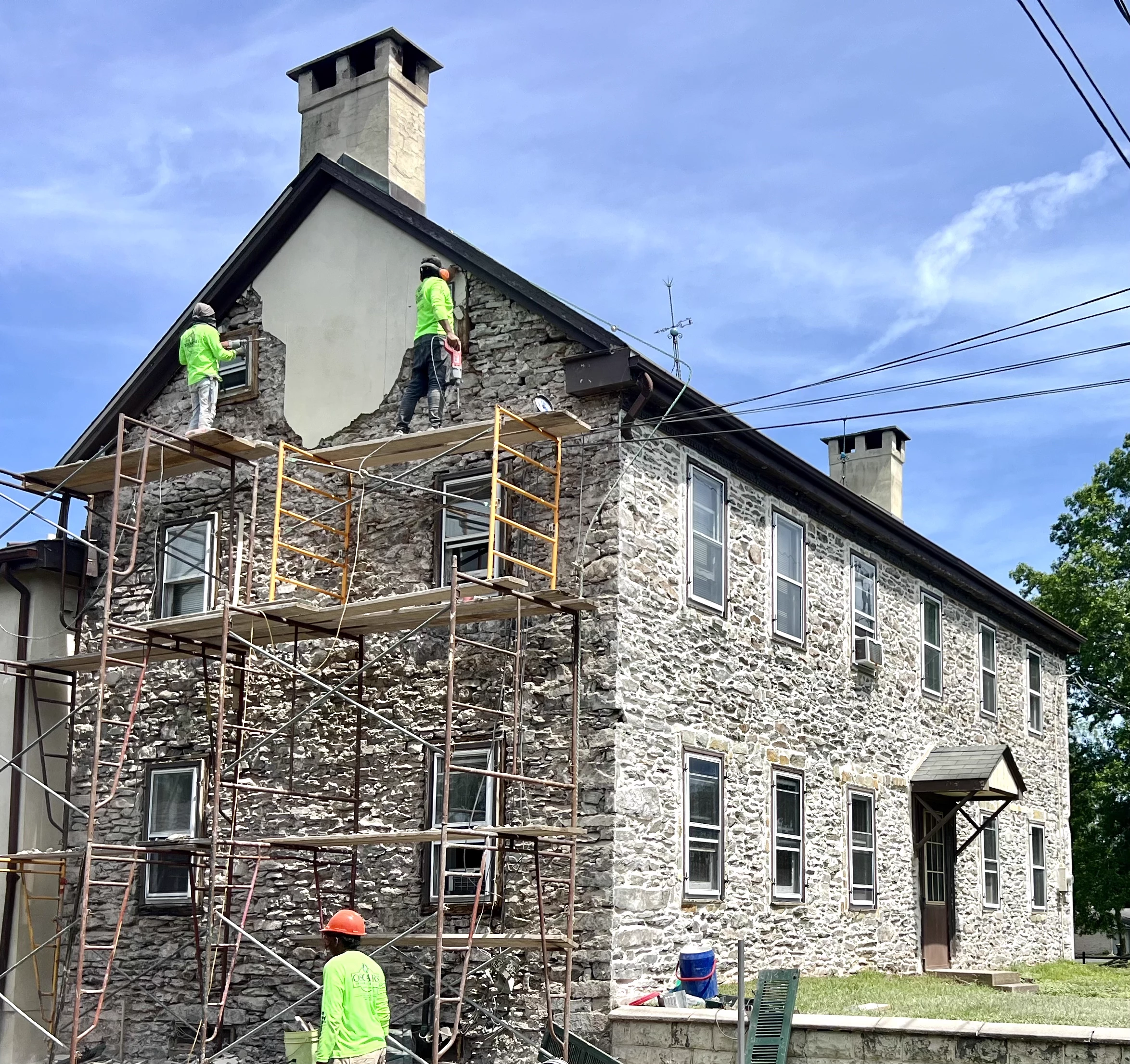 Stone veneer repointing repair on exterior wall