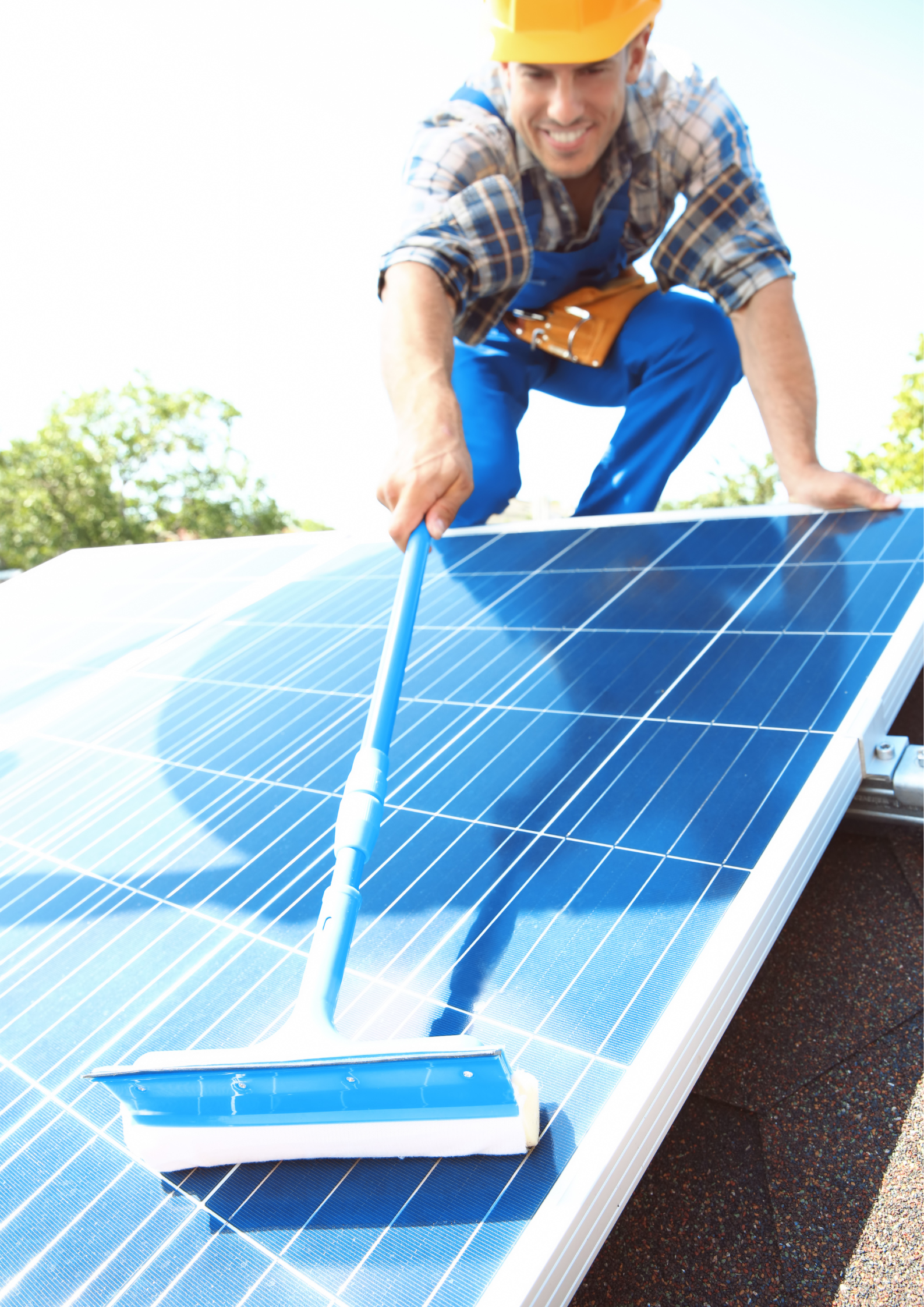 Technician cleaning a solar panel
