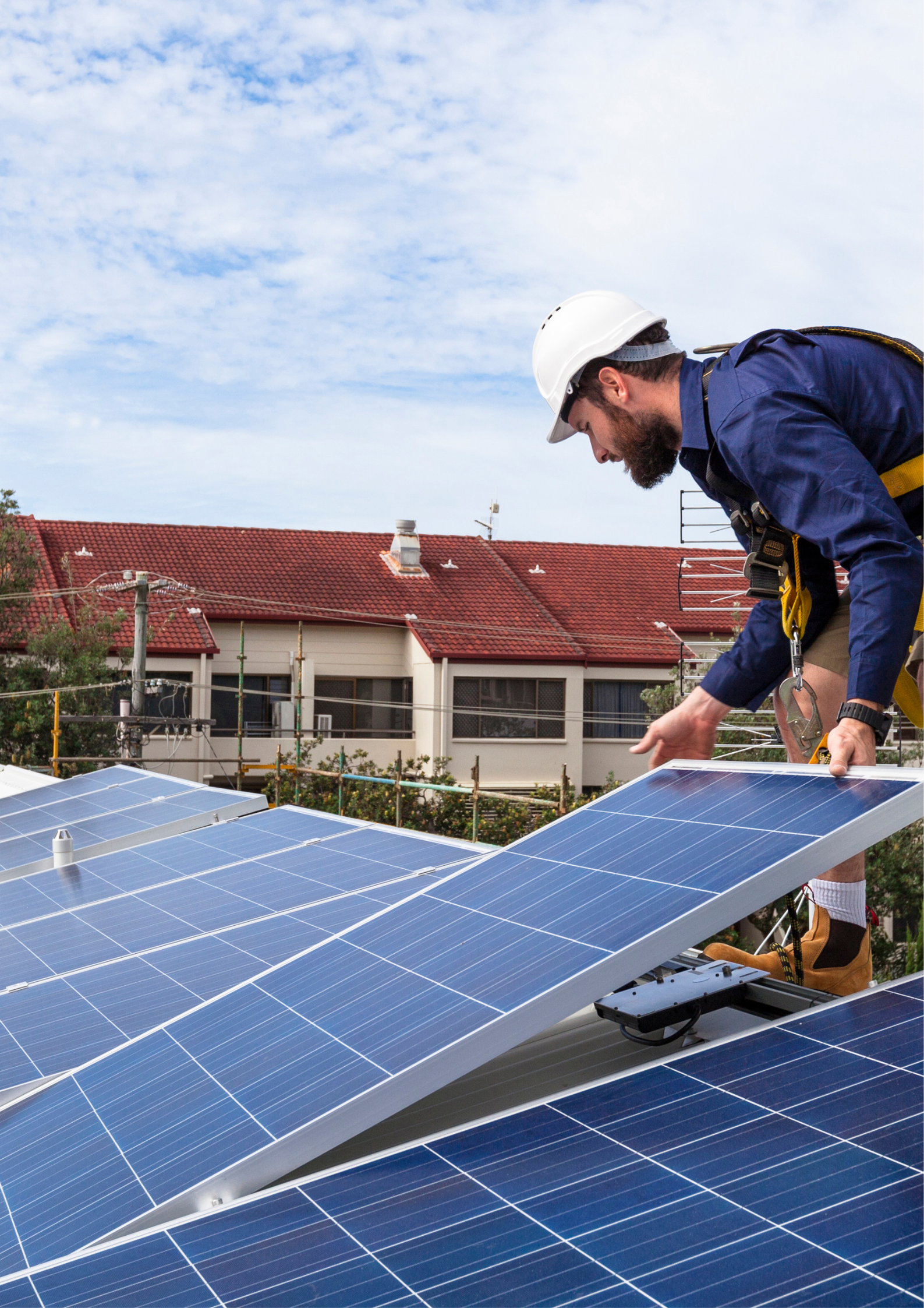 Installer setting a solar panel in place