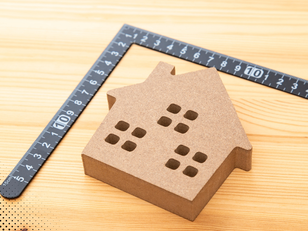 factors affecting home inspection cost with house model and measuring tool
