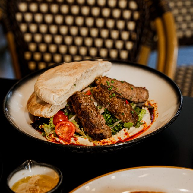 Kofta Pita with hummus, labneh and seasonal greens