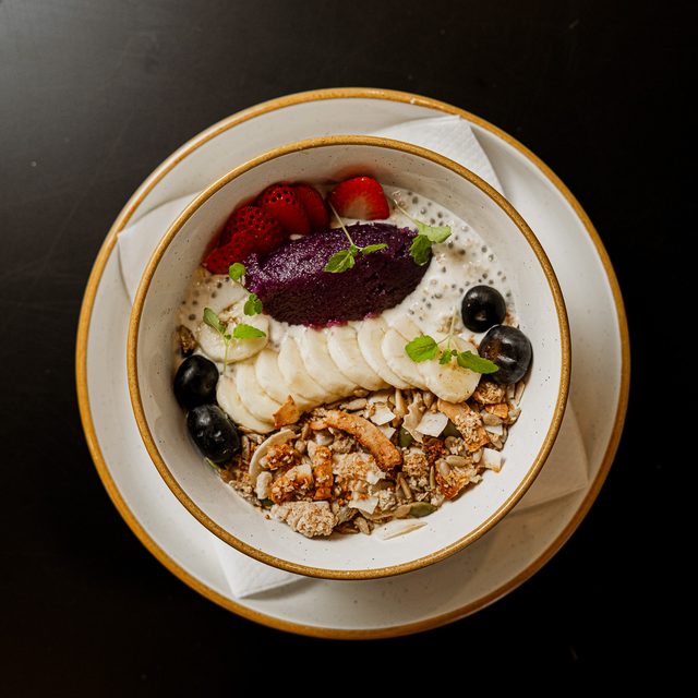 Ube Overnight Oats with granola and seasonal fruit