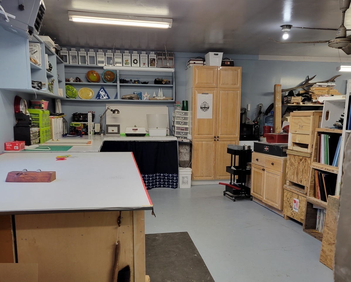Inside Catherine Bastedo's fused glass studio in Gimli — kiln, glass shelves, and work in progress