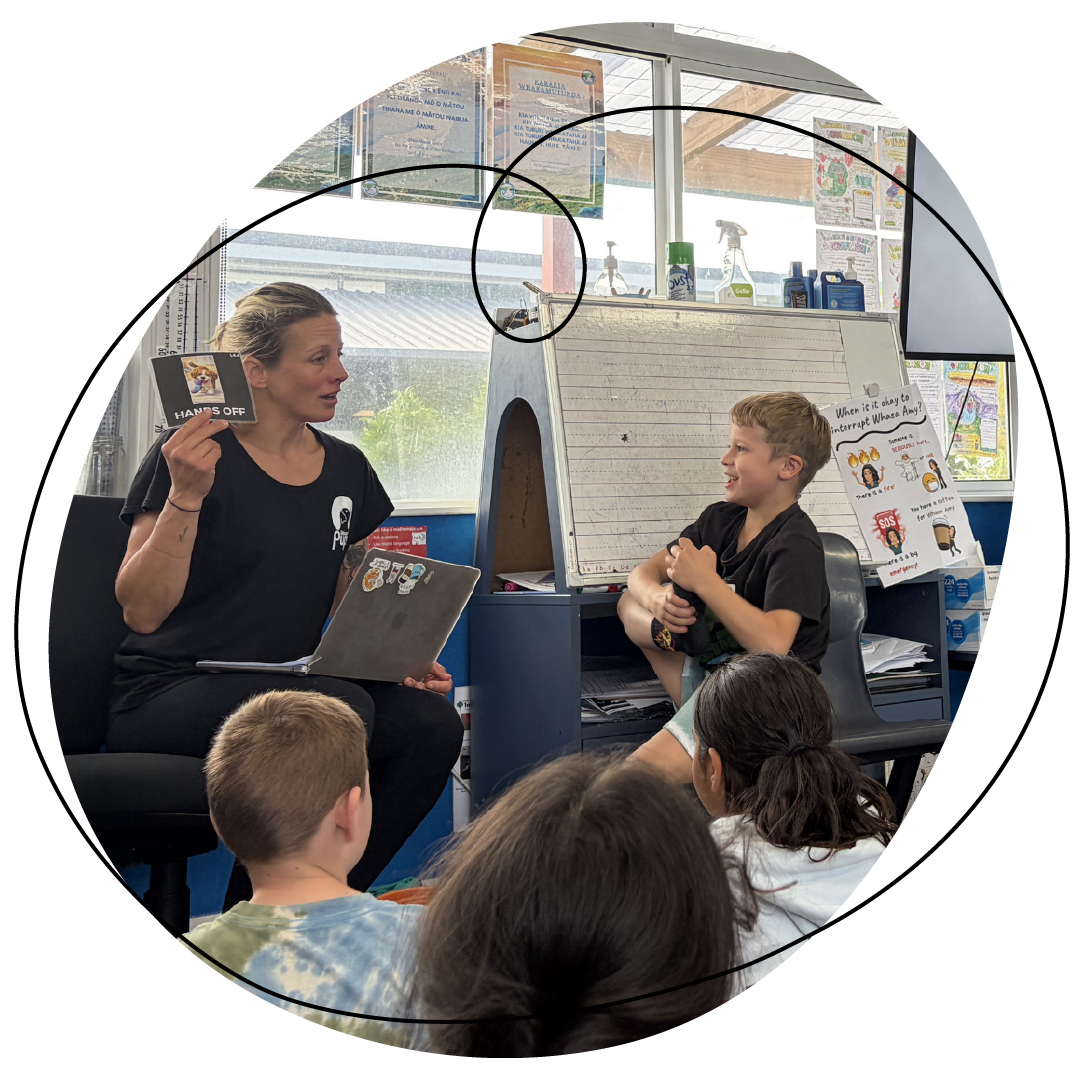 Renee in classroom teaching a lesson of teh og safety schools programme