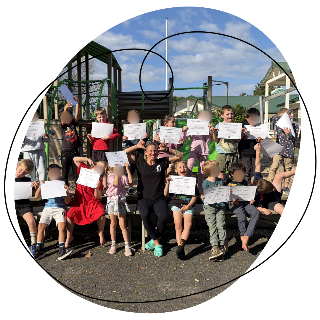 Renee with school classroom holding up their certificates after completing the dog safety schools programme