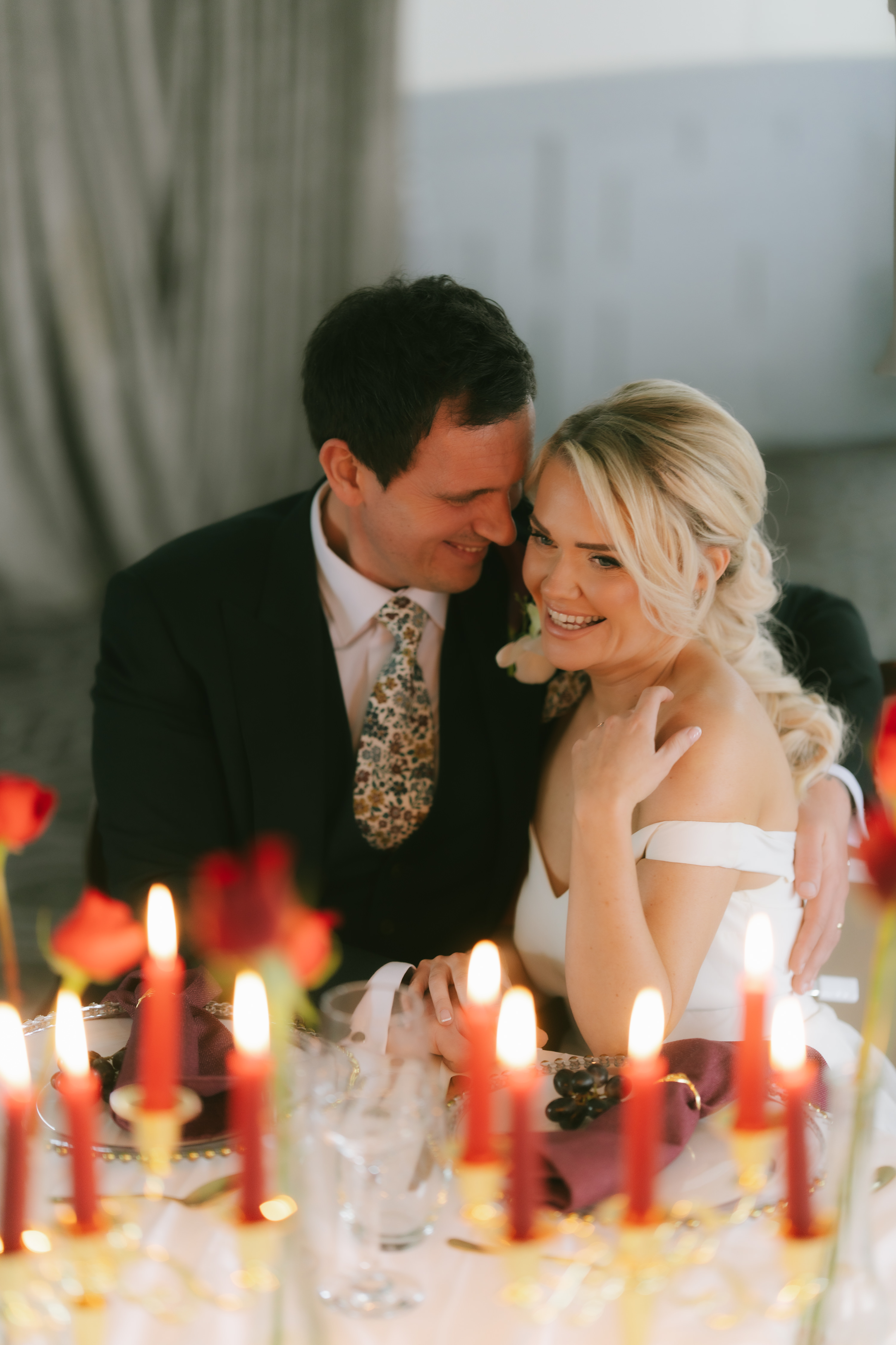 Bride and groom kiss at candlelit table Lincoln Suite Bridgerton styled shoot Berkshire wedding Bride and groom kiss at candlelit table Lincoln Suite Bridgerton styled shoot Berkshire wedding