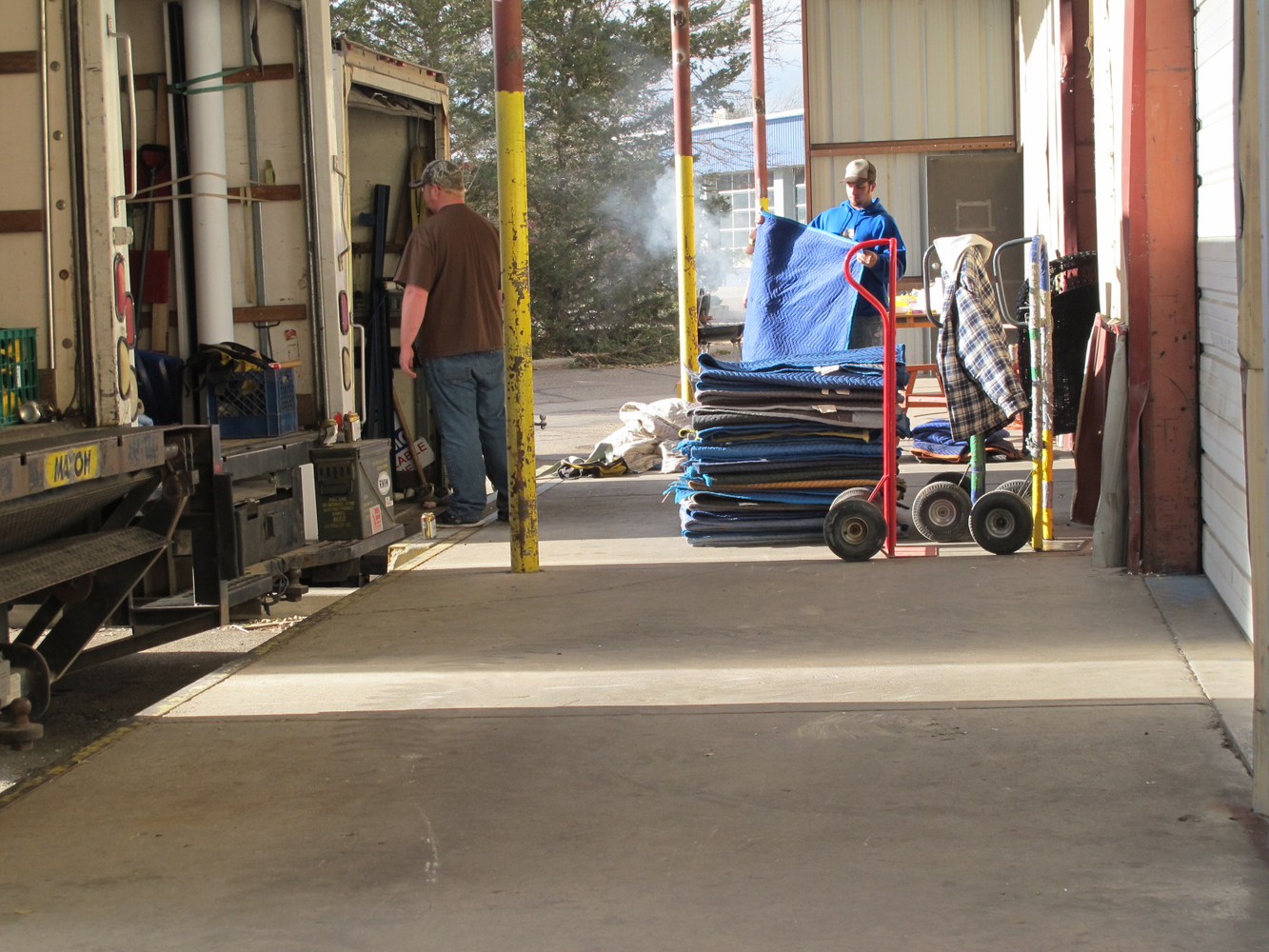 Fort Collins movers protecting furniture with moving blankets and wrap Fort Collins movers protecting furniture with moving blankets and wrap