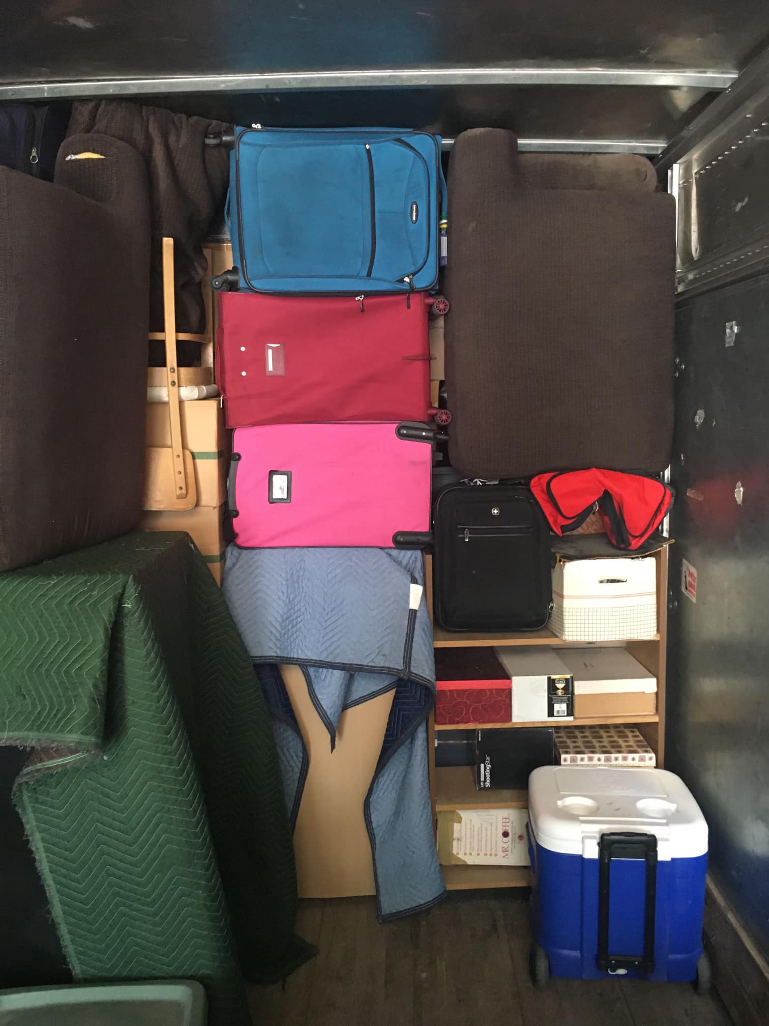 Fort Collins movers carefully packing a residential moving clients belongings