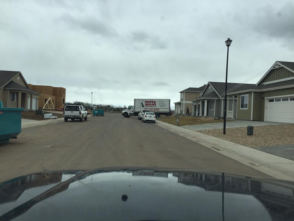 Moving truck parked outside a Fort Collins home